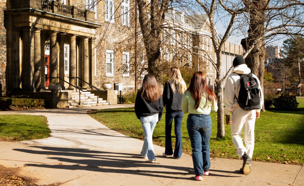 students walking outside Cumming Hall
