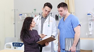 A Health Administrator instructs two young doctors