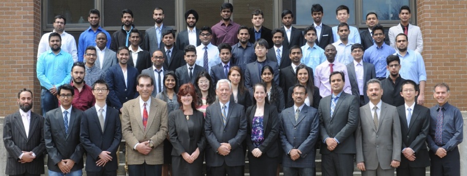 All the students, faculty and staff in the Master of Engineering Internetworking program standing together.