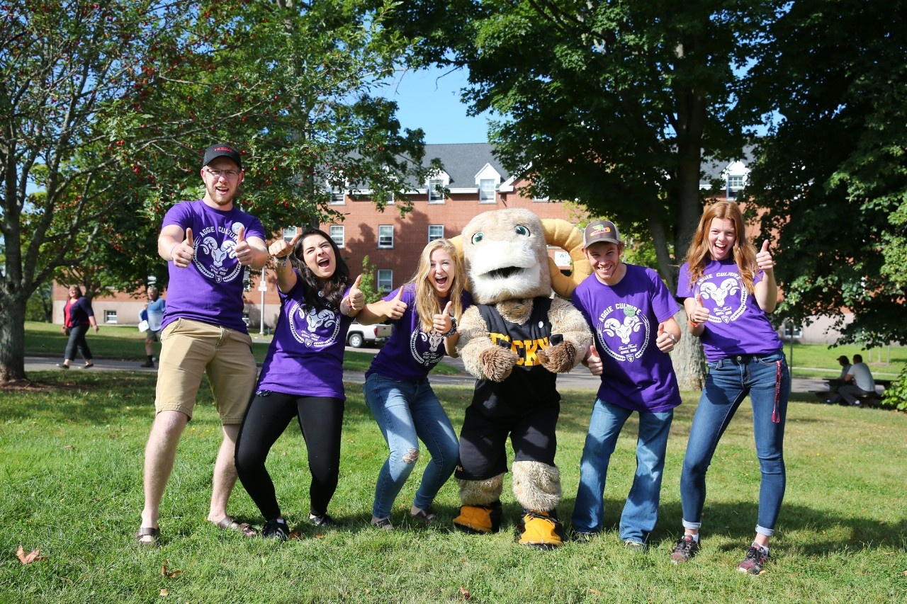 Students posing with mascot Rocky the Ram