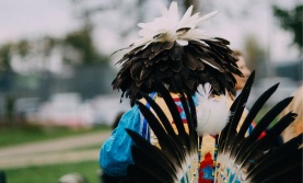 Indigenous perform in traditional regalia