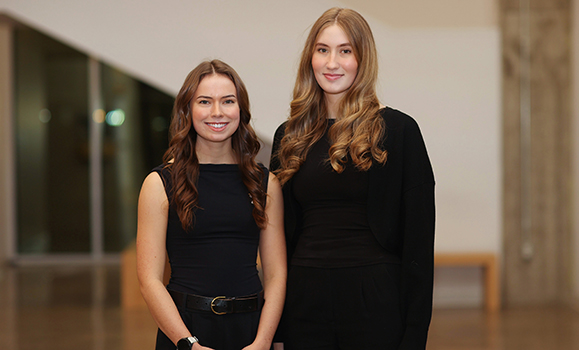 two women standing side-by-side