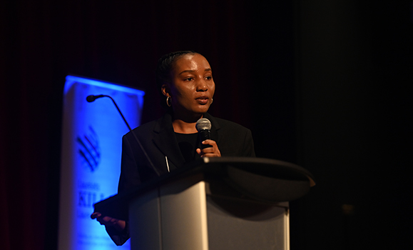 A person speaking into a microphone