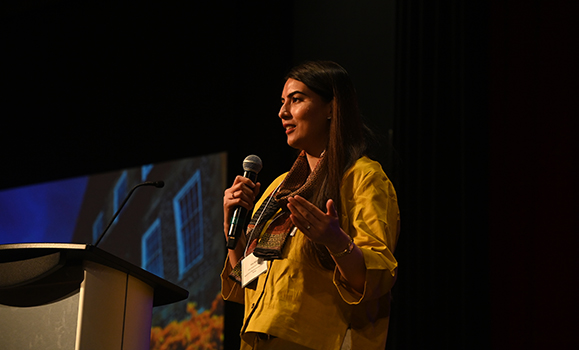 A person speaking into a microphone