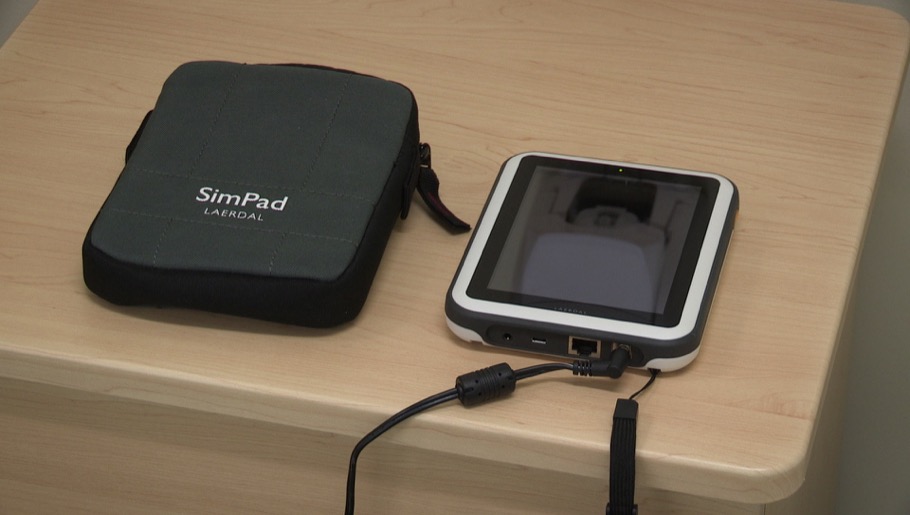 SimPad and battery connected to charger