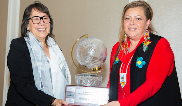 Christa Big Canoe and Sherry Pictou pose with the Ethical Leadership Award trophy.