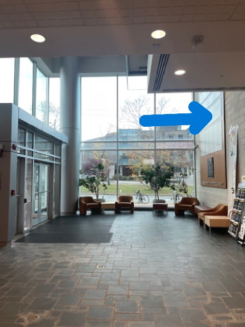 A view of the Rowe building lobby shows the main doors to the left and large windows ahead. An arrow points to the proposed location of the art installation on to the right.