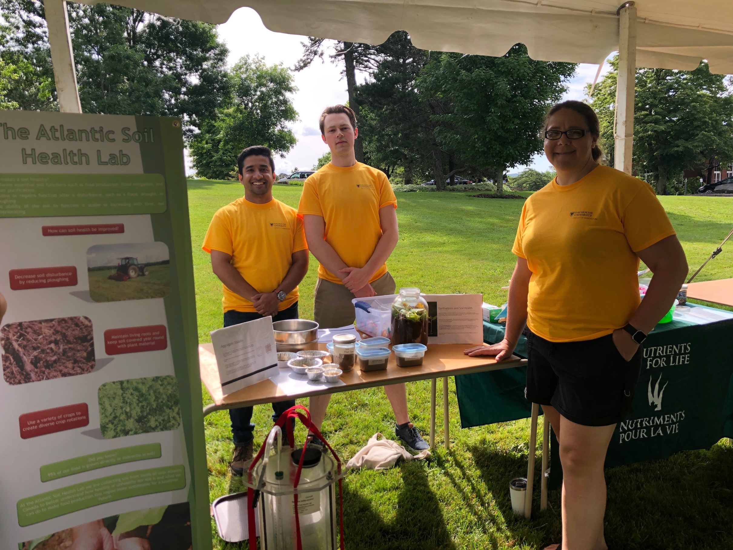 Our team standing by our community day table display