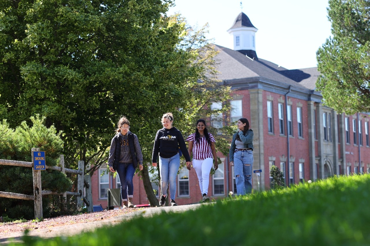 students walking outside of Cumming Hall