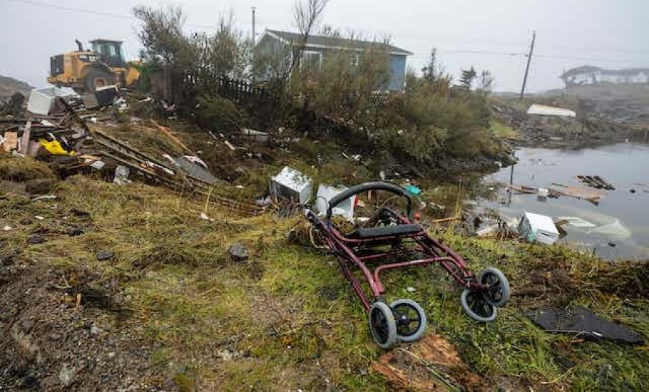 A walker lies among the debris following hurricane Fiona in Burnt Island, NL., on Sept. 28. THE CANADIAN PRESS/Frank Gunn