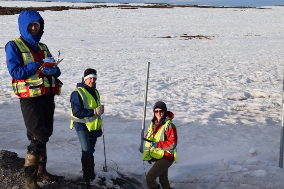 Dr. Rob Jamieson (centre) standing with members of his research team in the snow during fieldwork in the arctic community of Baker Lake, Nunavut.
