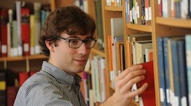 ĢAV researcher in library