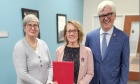Senator Colin Deacon recognizes Jolene MacEachern with King Charles III Coronation Medal