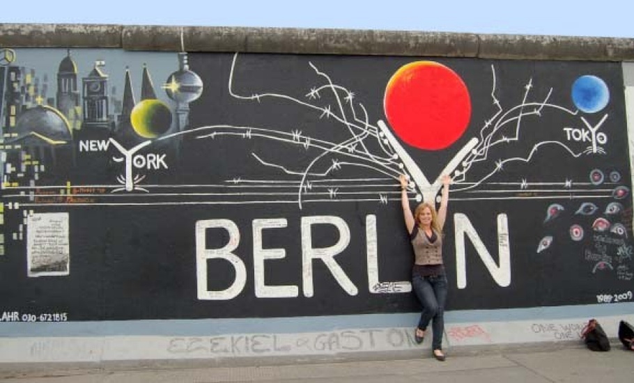 Student standing with hands up