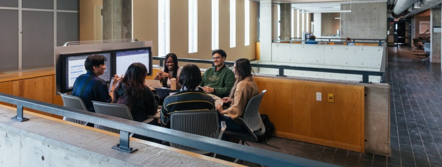 Group of students sitting at a collaboration station