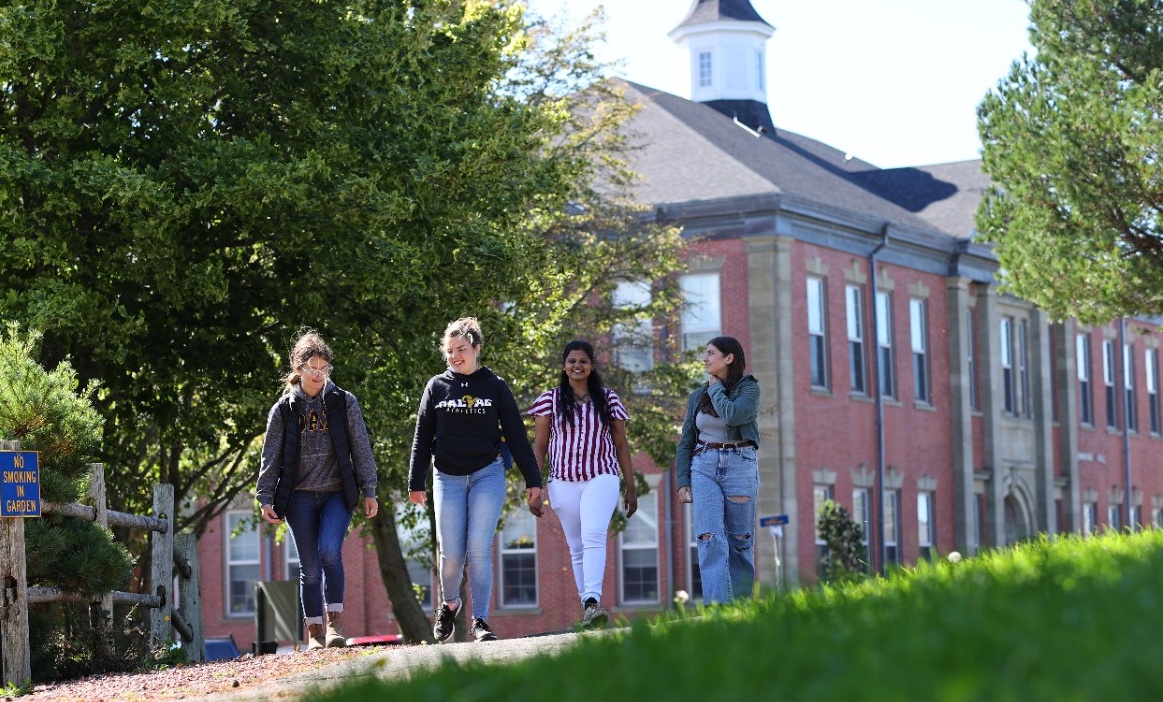 students walking outside of Cumming Hall