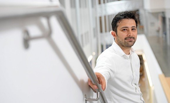 Arad Gharagozli looking cool on the stairs in the Emera IDEA Building.