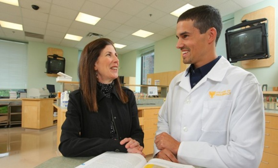 Two pharmacy faculty members in lab