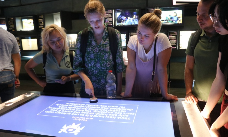 Program participants engaging with the displays at the Peres Center for Peace and Innovation in Tel Aviv