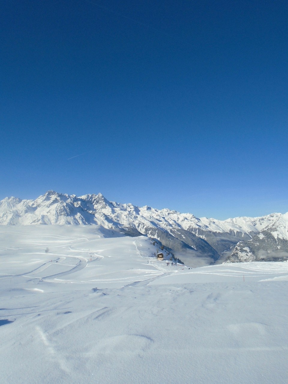 Snow covered mountains under a blue sky
