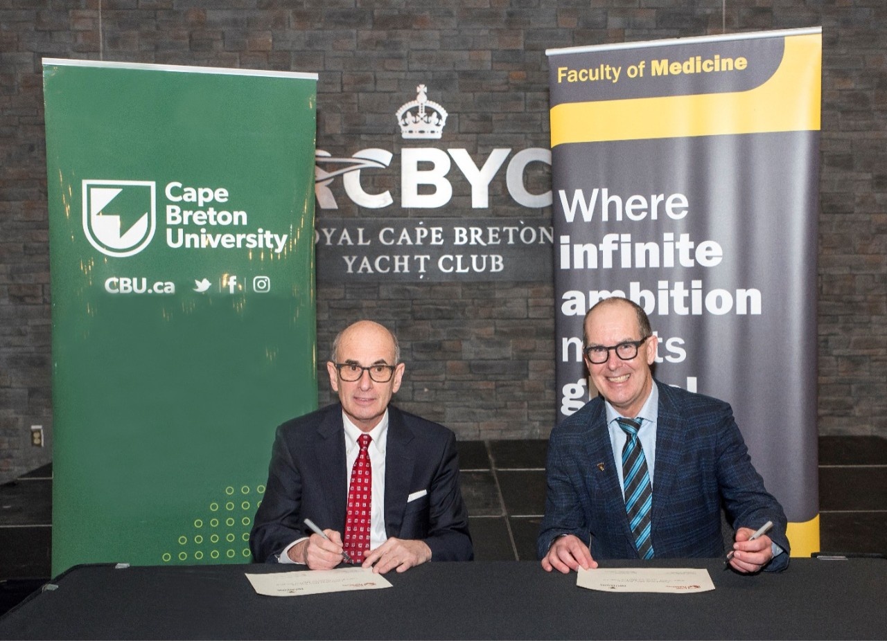 David C. Dingwall, President and Vice Chancellor of Cape Breton University, and David Anderson, Dean of the Dalhousie School of Medicine sign the MOU that will govern the development of the Cape Breton Medical Campus.