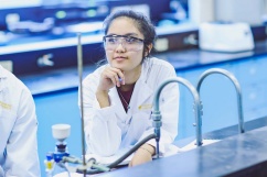 Student sitting at a desk in a lab