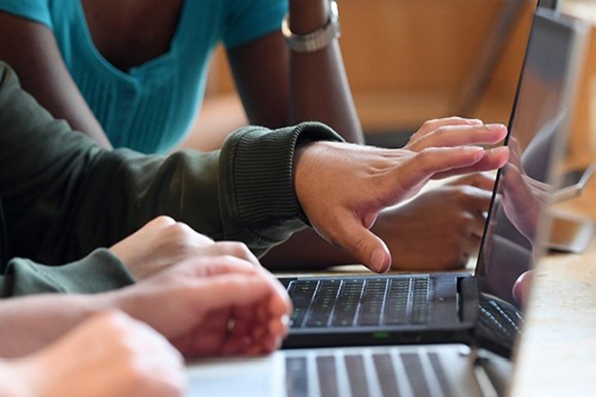 Close-up of hands at keyboard