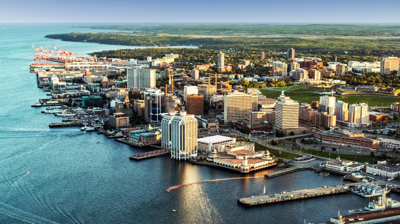 An aerial view of downtown Halifax and the harbour on a sunny day