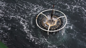 CTD Rosette being deployed to measure conductivity (salinity), temperature & depth while collecting water samples using Niskin Bottles. Photo Credit: Britton Dempsey