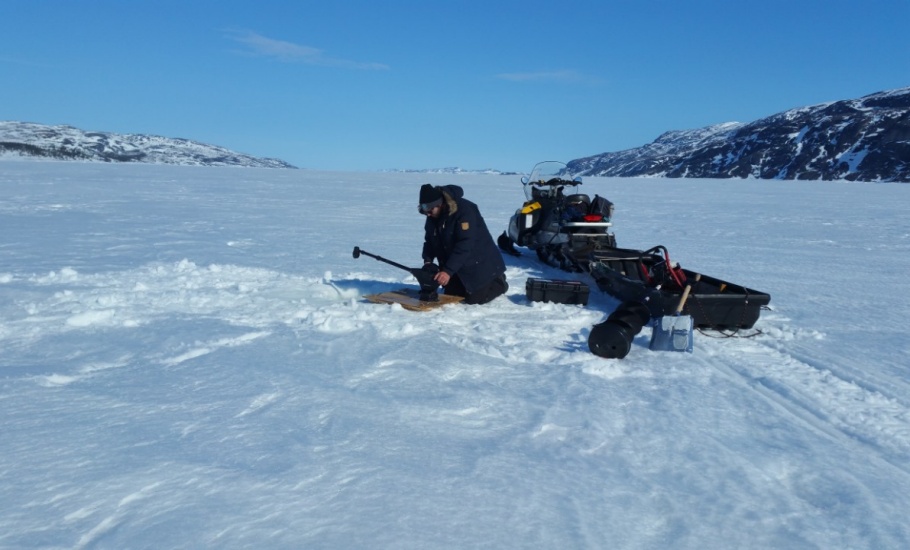 Nain, Labrador - Deploying a CTD through the sea ice to measure water temperature & salinity. April 2019. Photo credit: Eric Oliver