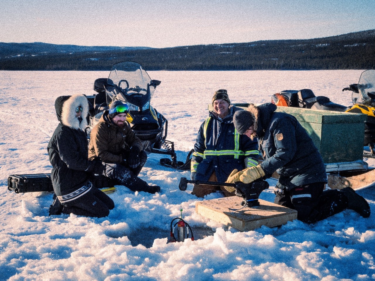 Casting a CTD on the ice Photo Credit: Katelyn Jacque