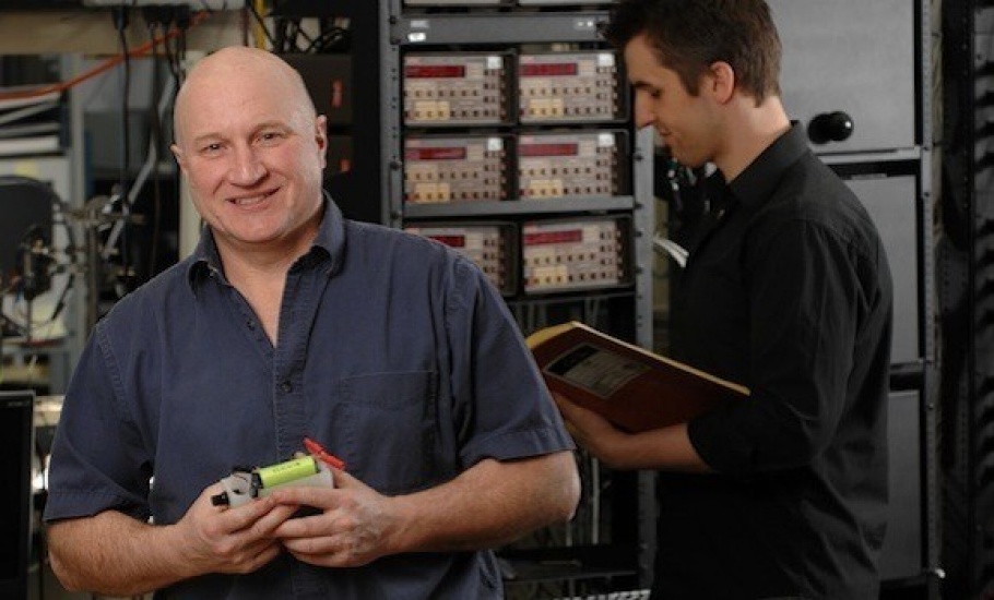 Physics professor Jeff Dahn works in his lab with a graduate student.