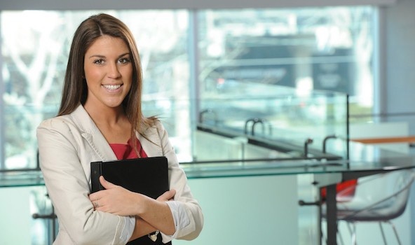 Woman holding portfolio in a lab.