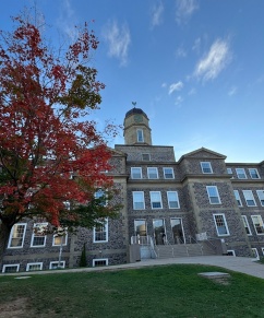 Students walk a along a Dal pathway on campus on a summer day.