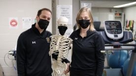 Physiotherapist smiling directly at camera