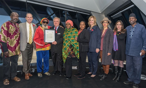 Dr. Cooper (centre, in green) with representatives from the Royal Ontario Museum and the Coalition for the Truth about Africa. (Roger Yip Photography) Dr. Cooper (centre, in green) with representatives from the Royal Ontario Museum and the Coalition for the Truth about Africa. (Roger Yip Photography)