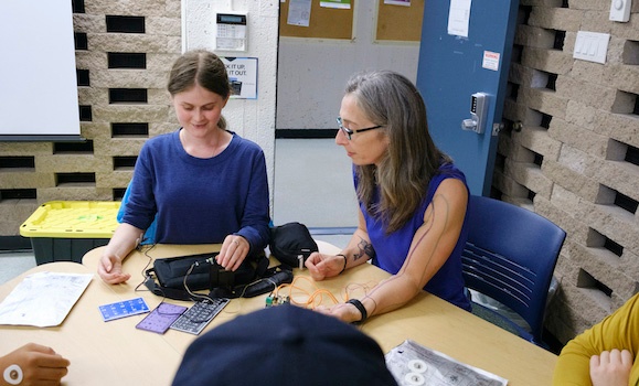 Student Gabrielle Close, left, and instructor Dr. Jennifer Stamp perform an activity for SuperNOVA summer camp participants over the summer. (Photo provided by SuperNOVA) Student Gabrielle Close, left, and instructor Dr. Jennifer Stamp perform an activity for SuperNOVA summer camp participants over the summer. (Photo provided by SuperNOVA)