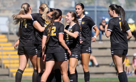 The women's soccer team celebrate a goal in their win on Sunday. (photo by Nick Pearce) The women's soccer team celebrate a goal in their win on Sunday. (photo by Nick Pearce)