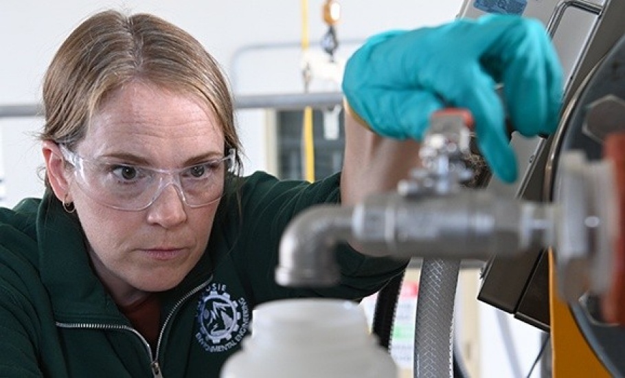 Water researcher Dr. Amina Stoddart prepare to take a wastewater sample. (Danny Abriel photos)