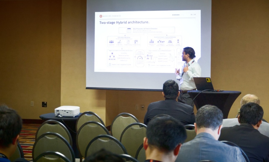 Niaz giving a slideshow presentation to a room of transportation professionals and researchers