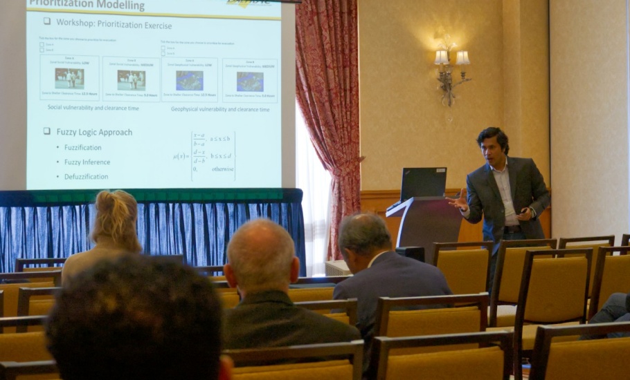 A man giving a presentation at a conference