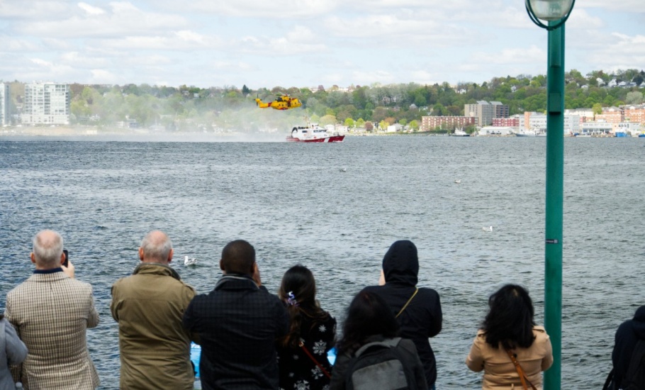 A Helicopter and boat doing Coast Guard training in the Halifax Harbour