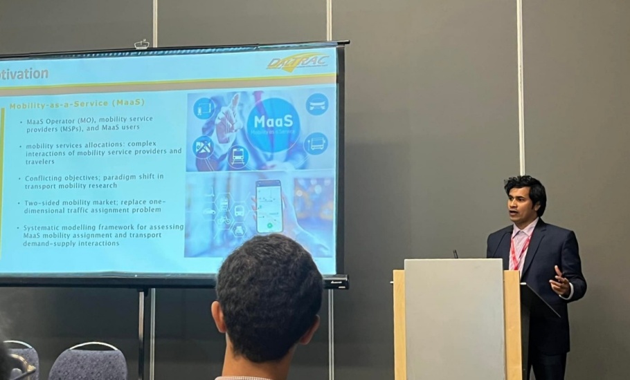 A man giving a presentation at a conference