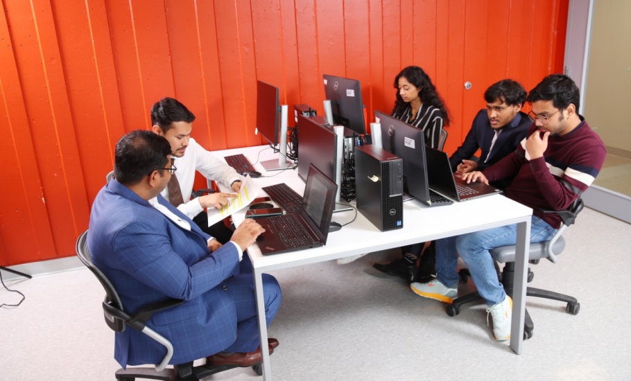 A table of students working together on different projects