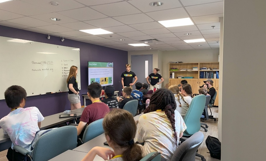 A group of DalTRAC students present information about the Share the Road Campaign