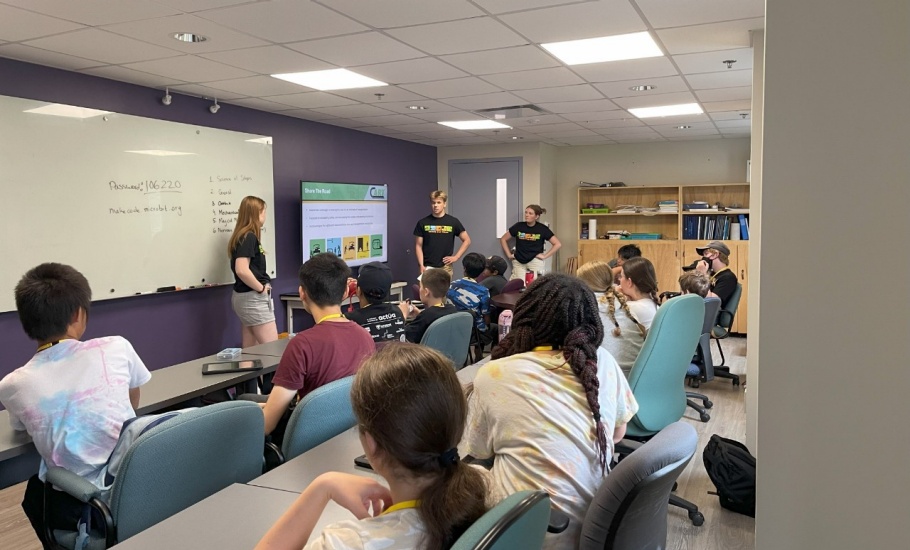 A group of DalTRAC students present information about the Share the Road Campaign