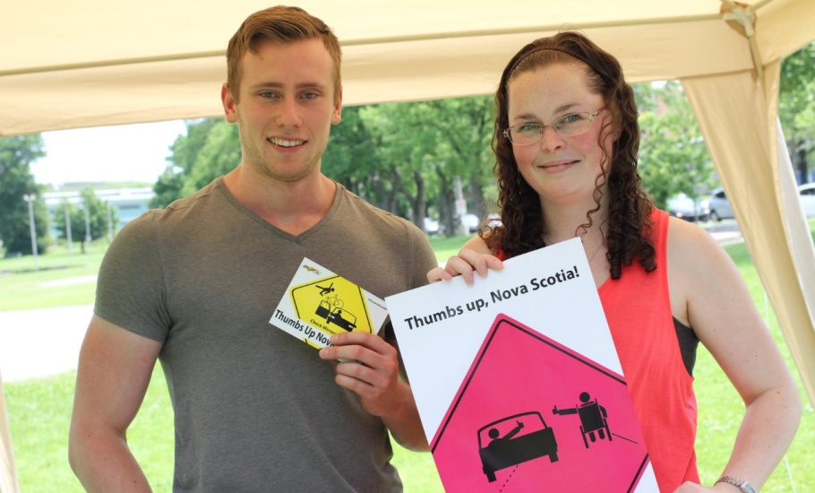 A man and woman promoting the share the road campaign