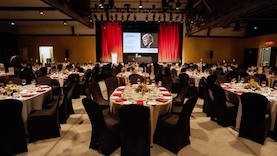 A room with tables set for the 2018 gala.
