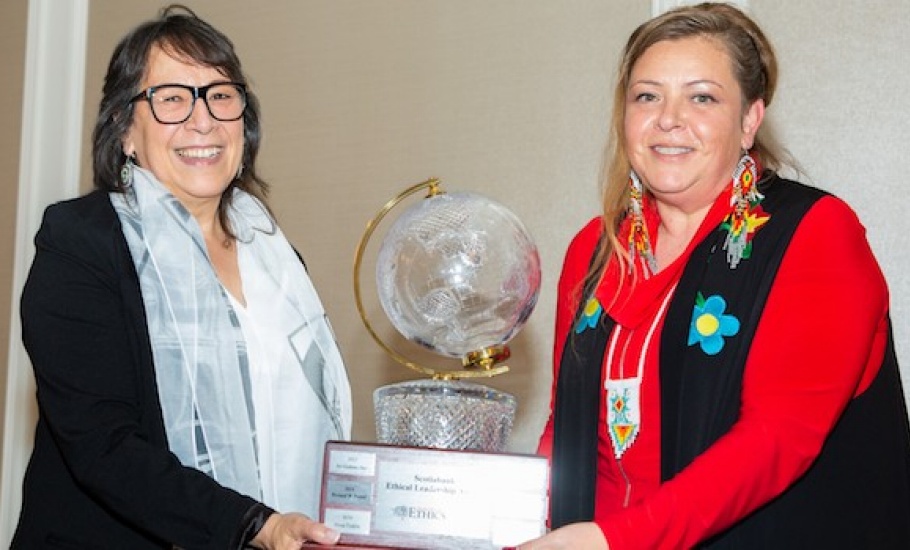 Christa Big Canoe and Sherry Pictou pose with the Ethical Leadership Award trophy